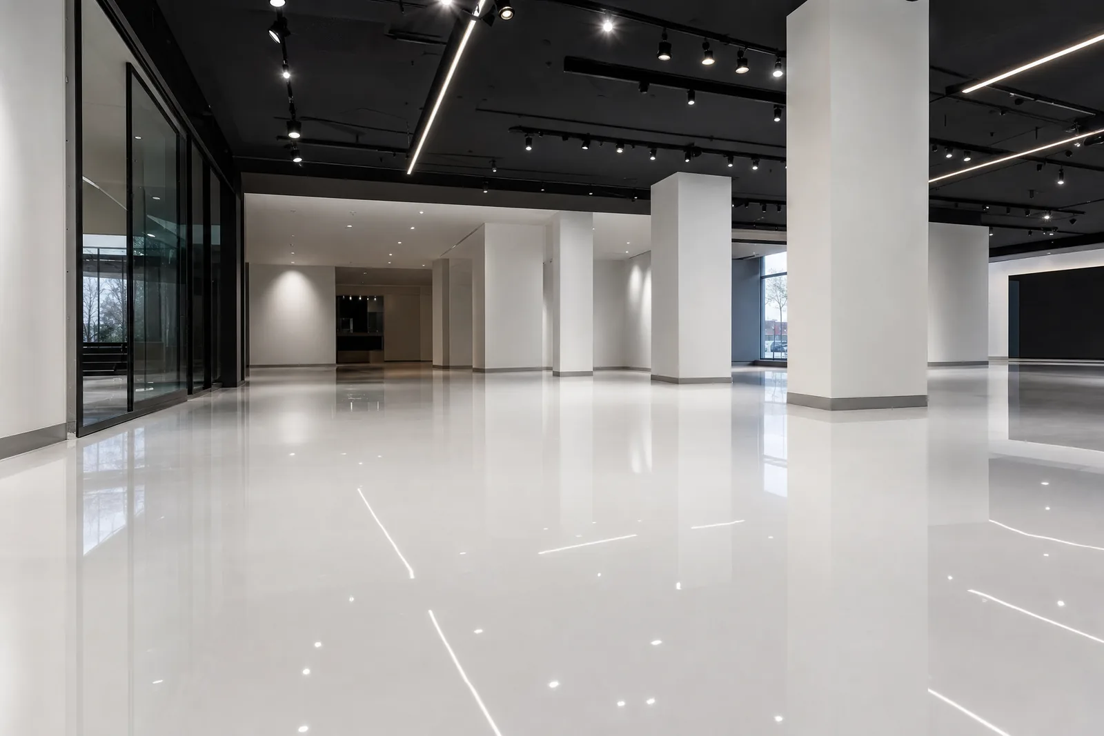 Automotive showroom with high-gloss white epoxy floor